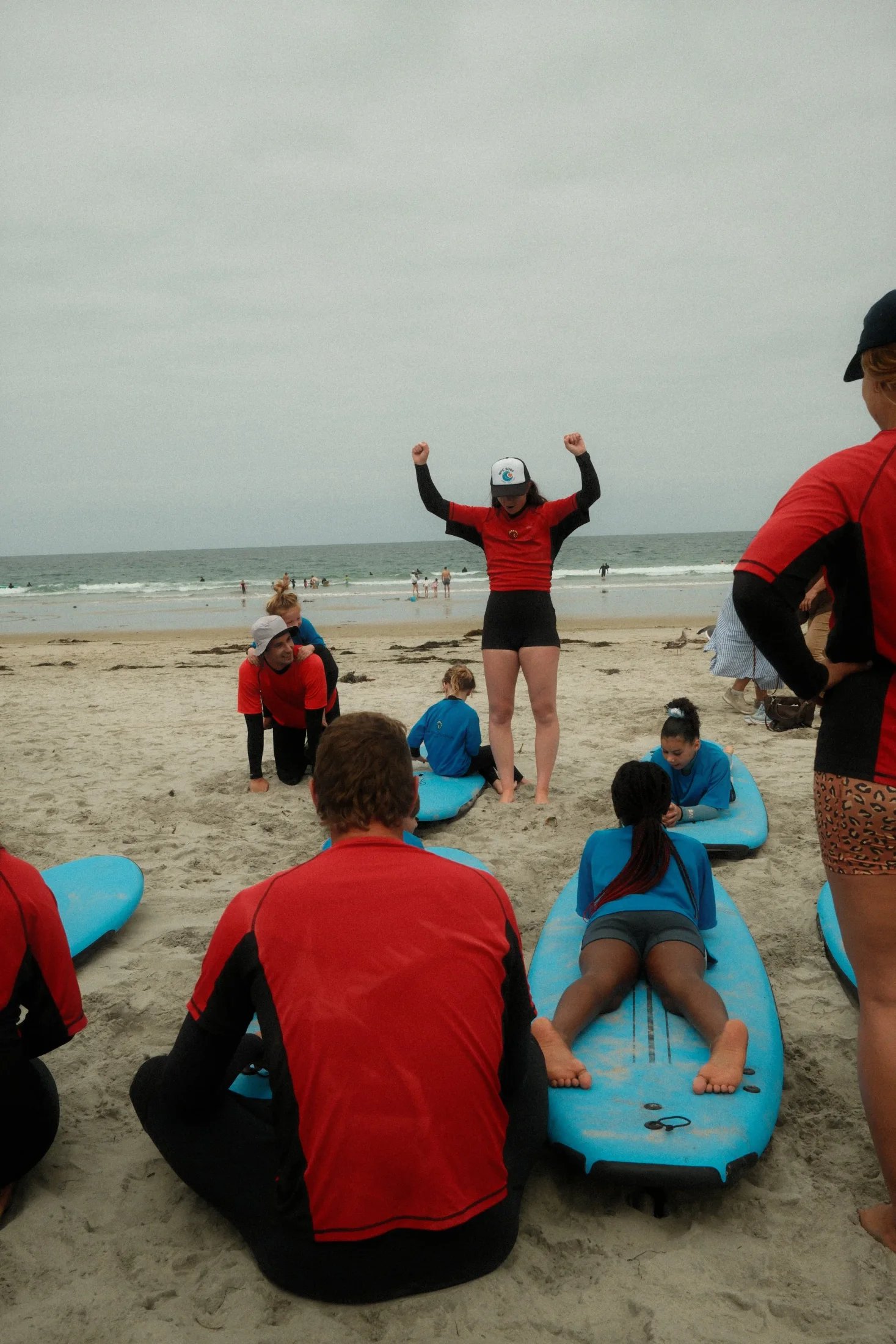 MTC Surf volunteers and participants preparing with surfboards on the beach